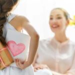 kid giving gift to mom for mother's day