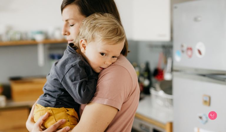 mom hugging toddler